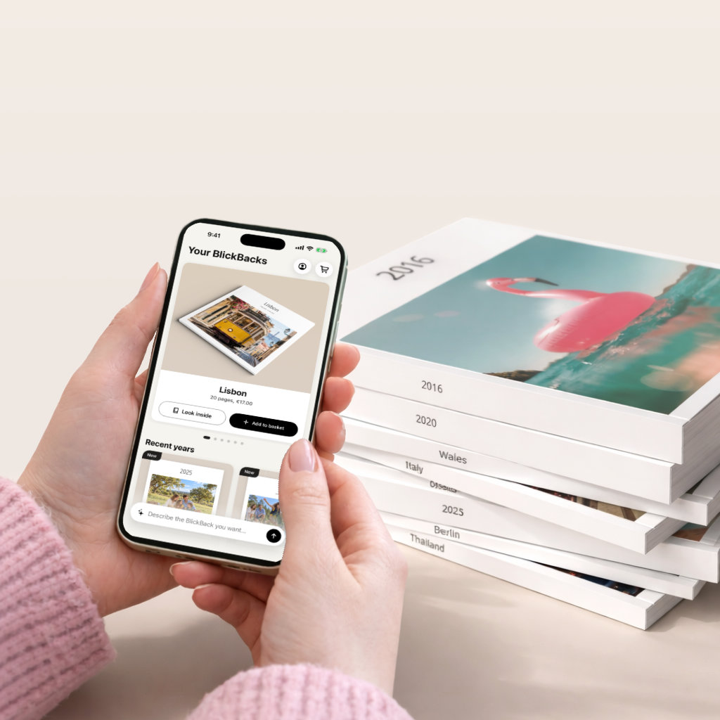 BlickBack app with a stack of printed photo books